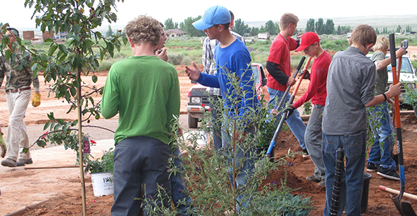 Students participate in an outdoor gardening and planting activity