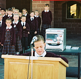 Student speaking behind a podium